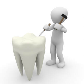 Dentist preparing tooth