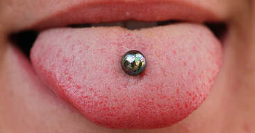 Tongue piercings can damage teeth and your oral health